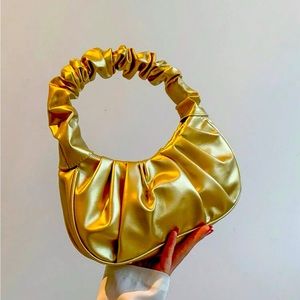 Gold purse and black and silver purse cross body